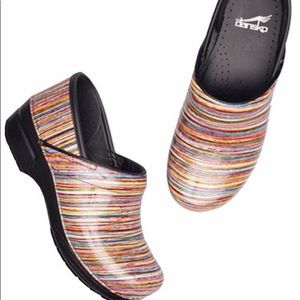 Multi colored dansko clogs does have worn spots